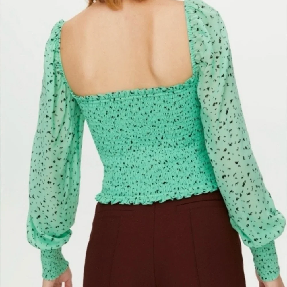 Aritzia green cropped chiffon top.